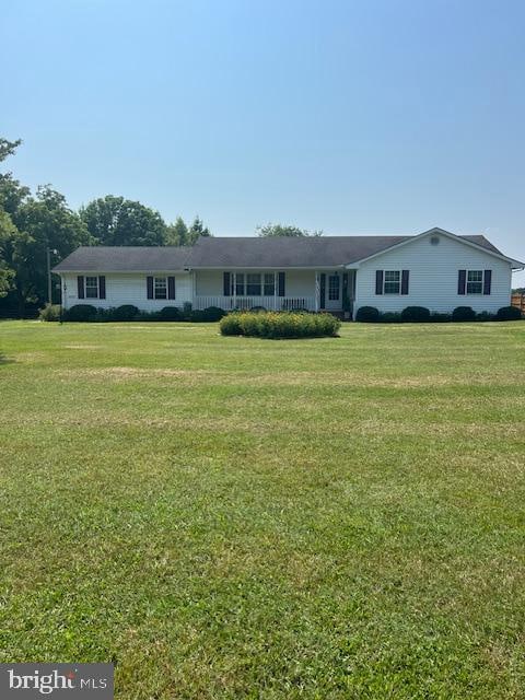 ranch-style house with a front lawn