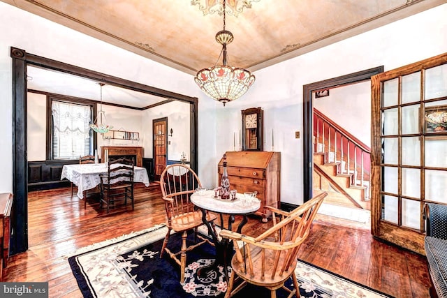 dining room with a notable chandelier and hardwood / wood-style floors