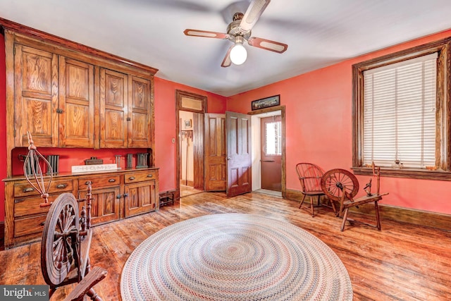 interior space with ceiling fan and light wood-type flooring