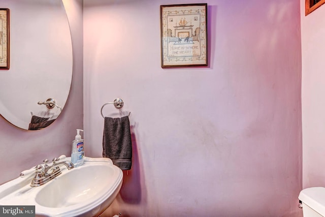 bathroom featuring sink and toilet