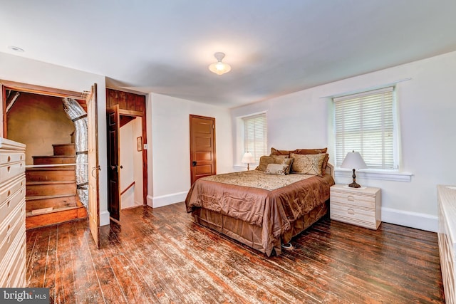 bedroom featuring dark hardwood / wood-style flooring