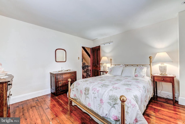 bedroom with hardwood / wood-style floors