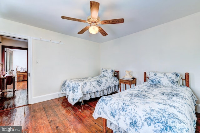 bedroom featuring ceiling fan and wood-type flooring