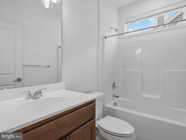 full bathroom with shower / bath combination, vanity, and toilet