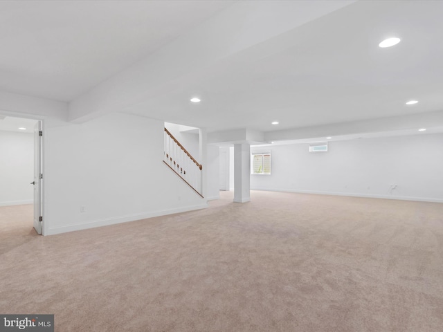 basement with light colored carpet