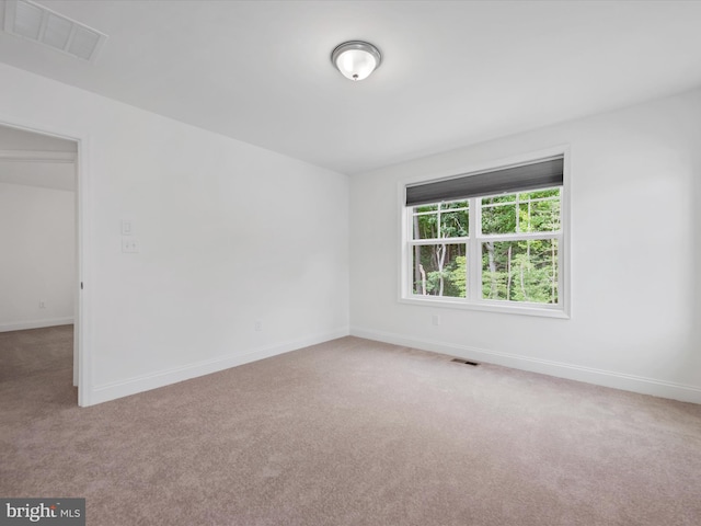 unfurnished room with carpet flooring