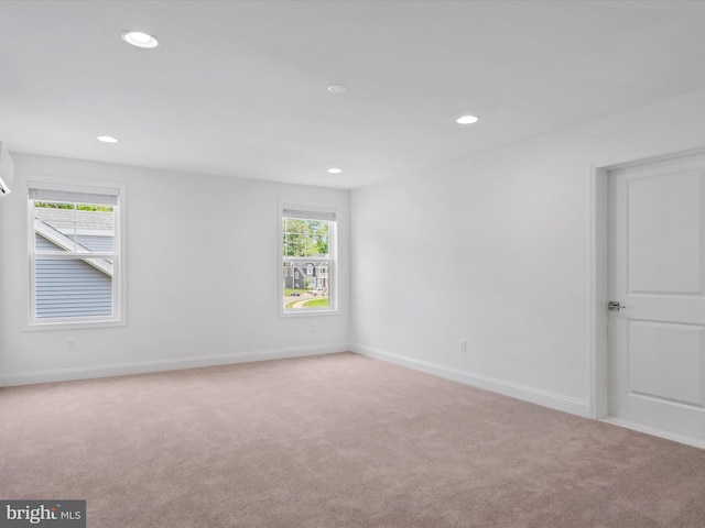 empty room with light colored carpet