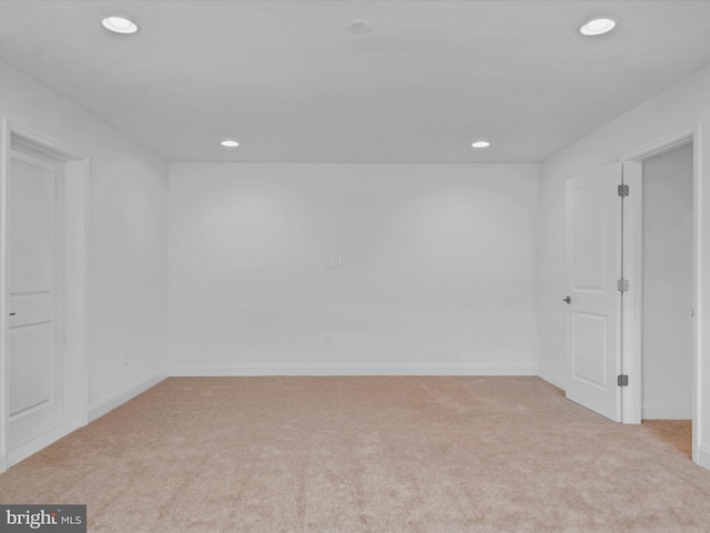 empty room featuring light carpet