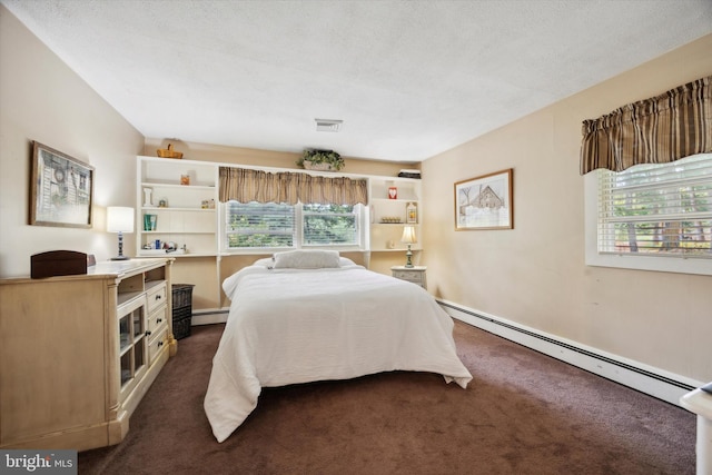 carpeted bedroom featuring a baseboard radiator, a textured ceiling, and multiple windows