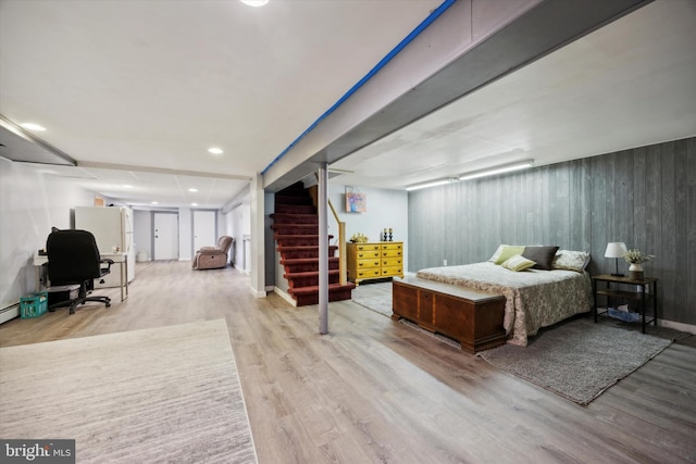 bedroom with light hardwood / wood-style floors