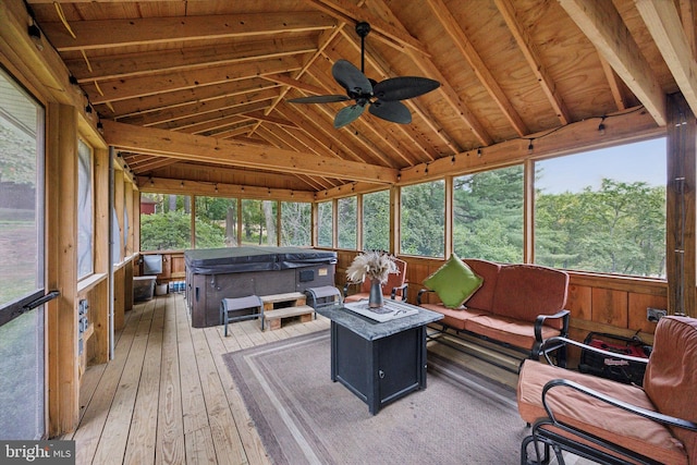 sunroom featuring ceiling fan, vaulted ceiling with beams, and wood ceiling