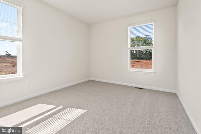 unfurnished room featuring carpet floors