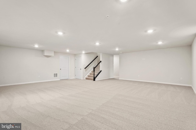 basement with light colored carpet