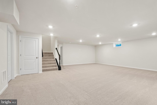 basement with light colored carpet