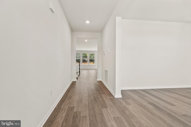 hall with light hardwood / wood-style floors