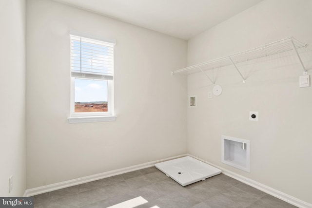 clothes washing area with gas dryer hookup, washer hookup, and electric dryer hookup