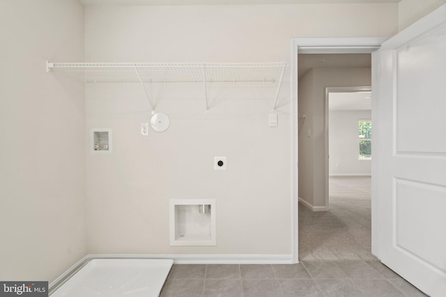 laundry area featuring hookup for a gas dryer, electric dryer hookup, hookup for a washing machine, and light tile patterned floors