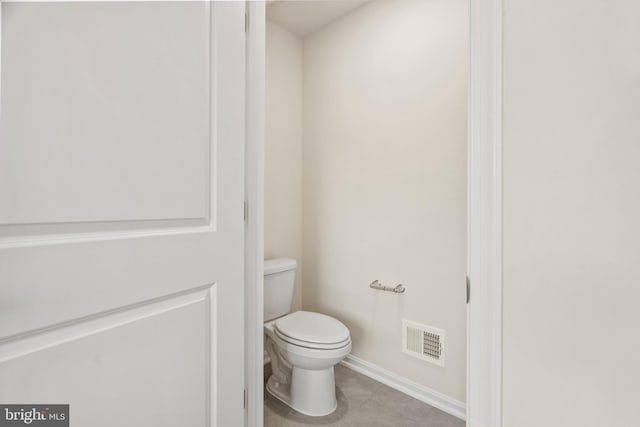 bathroom with tile patterned floors and toilet