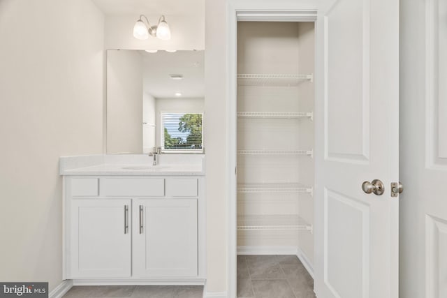 bathroom with vanity and tile patterned flooring