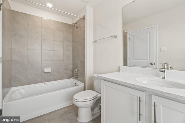 full bathroom with vanity, toilet, tile patterned floors, and tiled shower / bath