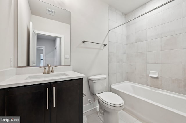 full bathroom with vanity, tiled shower / bath, and toilet