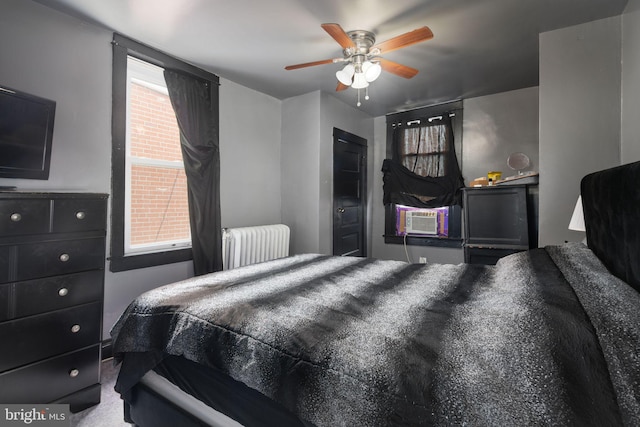 bedroom featuring radiator, ceiling fan, cooling unit, and carpet floors