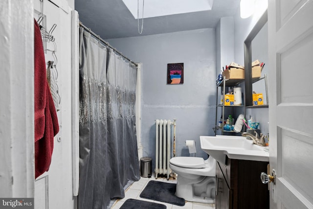 bathroom with tile patterned flooring, radiator, toilet, and vanity