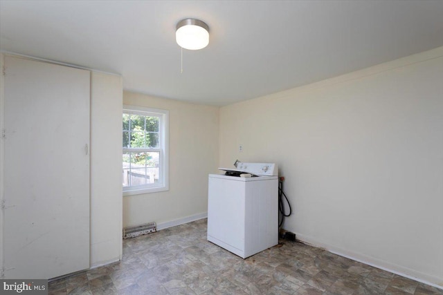 clothes washing area featuring washer / dryer