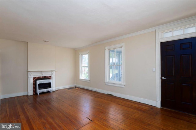 unfurnished living room with dark hardwood / wood-style flooring, a fireplace, and ornamental molding