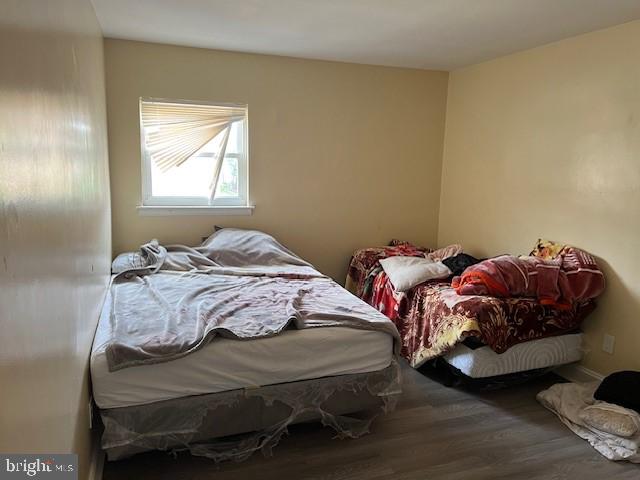 bedroom with wood-type flooring