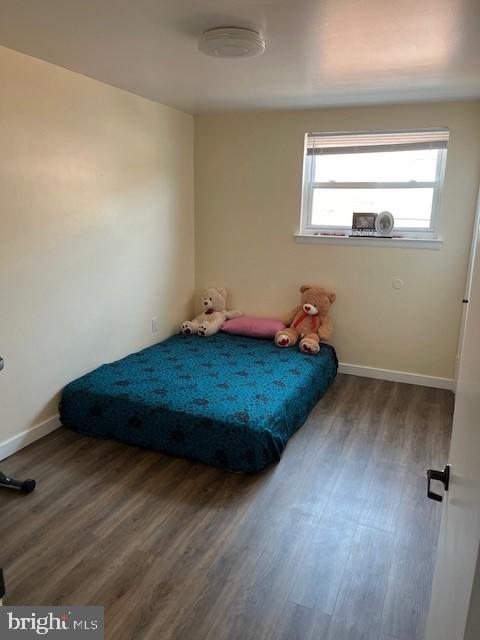 bedroom with hardwood / wood-style floors