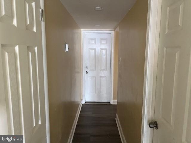 hallway featuring dark hardwood / wood-style floors