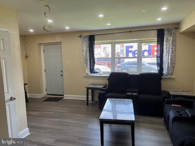 living room featuring dark wood-type flooring