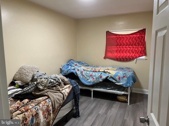 bedroom featuring wood-type flooring