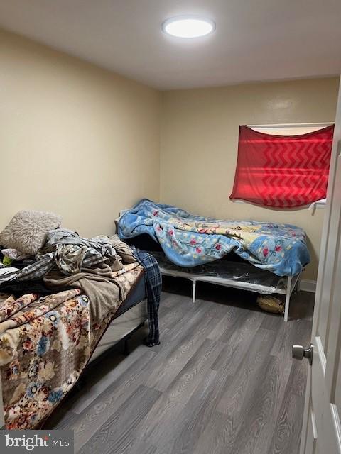 bedroom with hardwood / wood-style floors