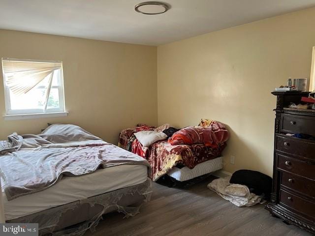 bedroom with hardwood / wood-style flooring