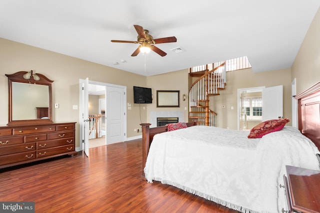 bedroom with dark wood-type flooring