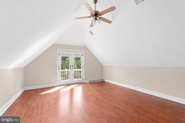 bonus room featuring lofted ceiling, hardwood / wood-style floors, and ceiling fan