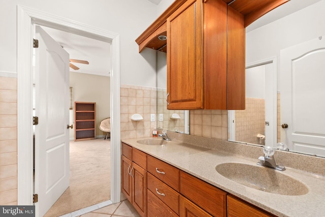 bathroom with vanity, tasteful backsplash, and tile patterned floors