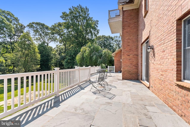 view of patio with a balcony