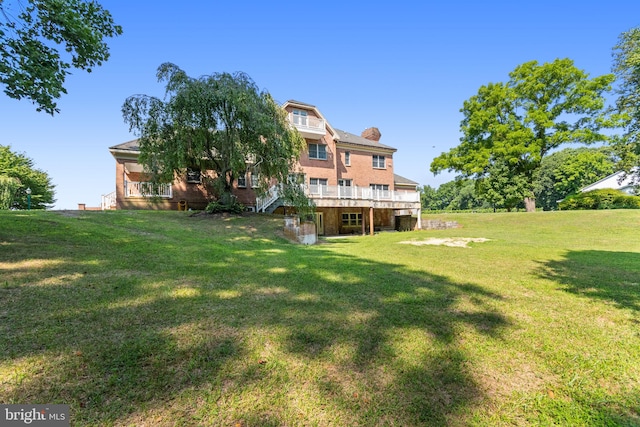 view of yard with a wooden deck