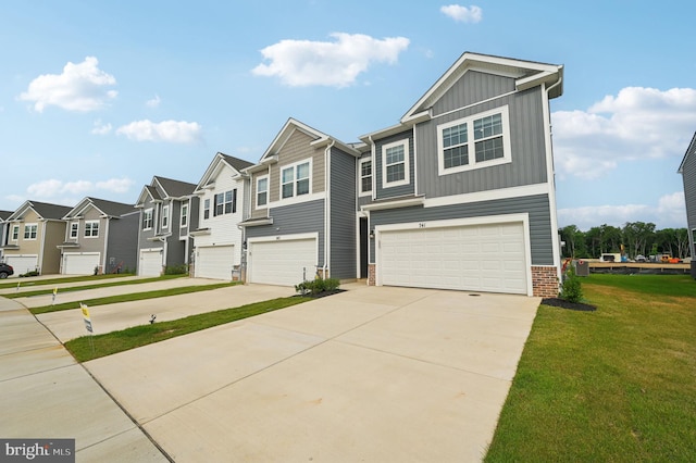 view of front facade with a garage and a front lawn