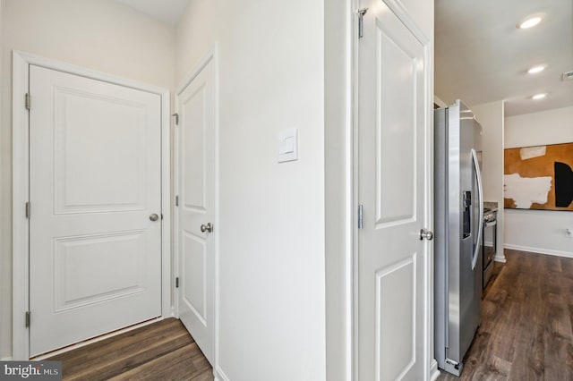 hallway featuring dark hardwood / wood-style flooring