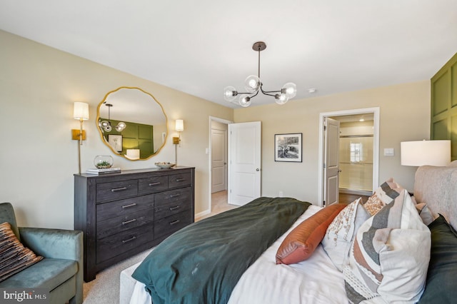 bedroom with an inviting chandelier, light carpet, and ensuite bathroom