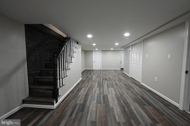 basement featuring dark hardwood / wood-style floors