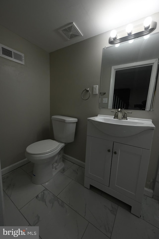 half bathroom with marble finish floor, toilet, baseboards, and visible vents