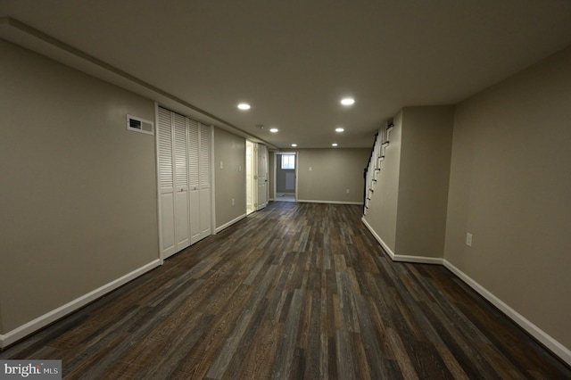 interior space featuring visible vents, dark wood-style flooring, baseboards, and recessed lighting
