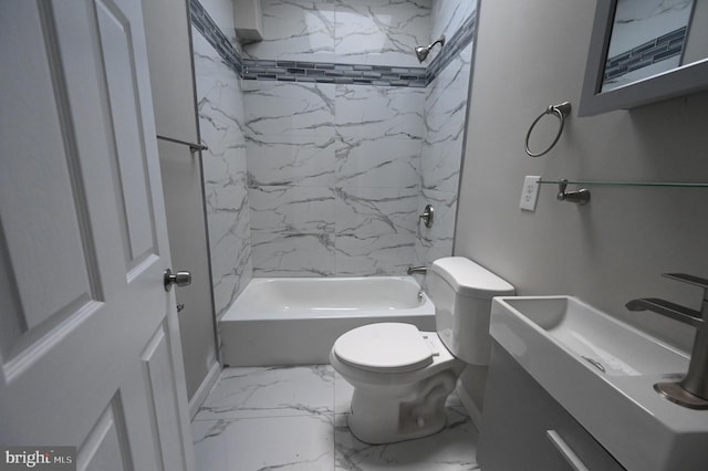 full bathroom with vanity, tiled shower / bath combo, and toilet