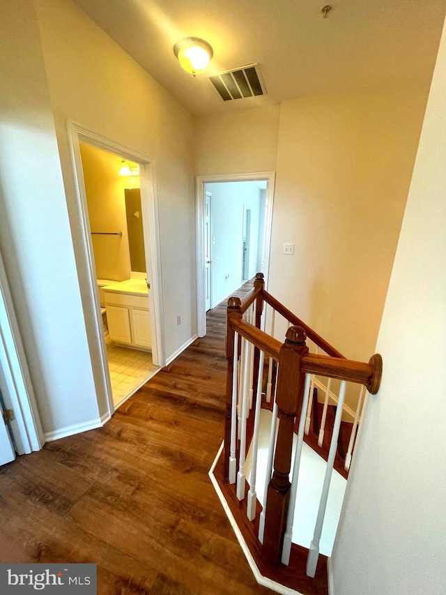 hall with dark hardwood / wood-style floors