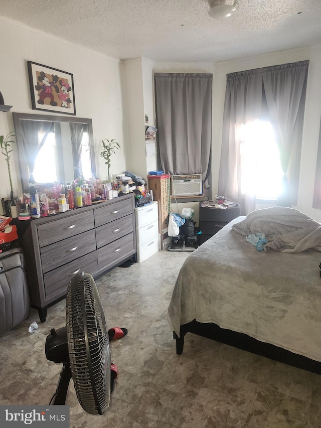 bedroom featuring a textured ceiling and tile patterned flooring